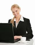 Beautiful business woman working on laptop