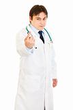 Confident medical doctor ordering to come
