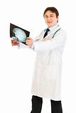 Smiling medical doctor pleased with results of heads  roentgen

