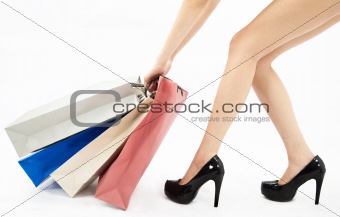 Woman legs and shopping bags