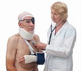 Doctor attending old man with multiple injuries