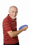 Active senior man with frisbee