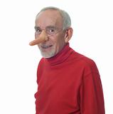 Old man wearing long false nose and smiling