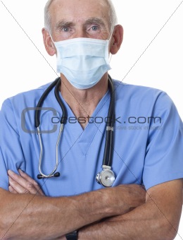 Male surgeon in blue scrubs and face mask