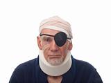 Old man with bandaged head and eye patch