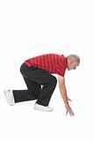 Senior man performing squat exercise