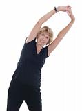 Senior woman raising arms in stretch exercise