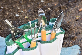 Detail of gardening tools in tool bag - outdoor
