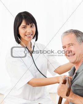 Nurse with her patient looking at the camera