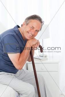Retired man with his walking stick