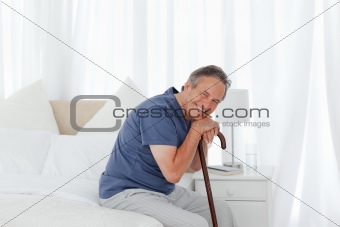 Retired man with his walking stick