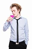Young man drink pink wine.