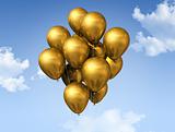 gold balloons on a blue sky
