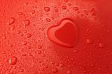 heart of water on a red surface