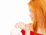lovely redhead with white cup on breakfast