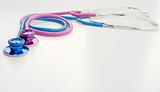 pink and blue stethoscopes