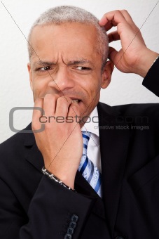 Stressed Businessman Biting His Nails
