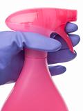 Pink Gloved Hand on Spray Bottle Cleaning Concept