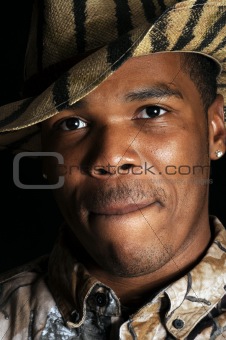 young African American man in hunting hat and shirt - closeup