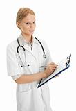 Cheerful medical doctor woman filling out prescription
