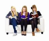 Three girls teen carefully read the books