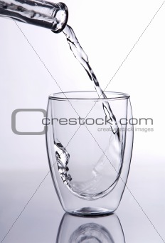 Water falling into glass