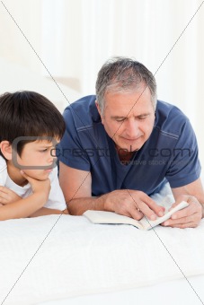 Young boy listening his grandfather
