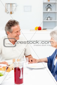 Retired couple eating  in the kitchen