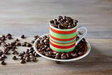 Coffee beans in striped cup