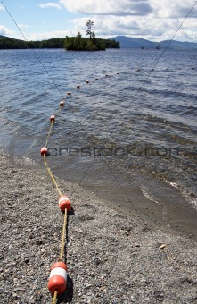 Buoys leading into pristine lake