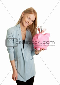 Beautiful young woman saving money