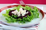 appetizer salad of beets and goat cheese with basil