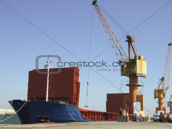 Big ship unloading in dock