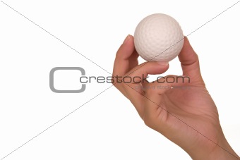 Hand holding golf ball