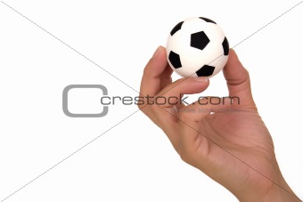 Hand holding soccer ball