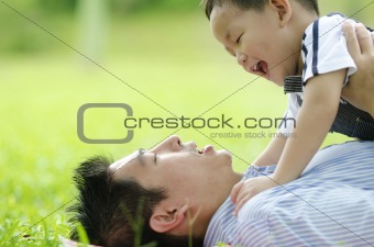 asian dad playing with son