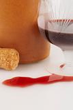 Glass  with wine, cork and bottle