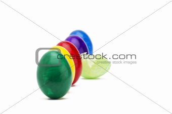 light green broken easter egg between other easter eggs