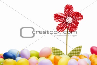 red drapery flower between easter eggs