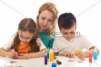 Kids busy painting with lots of colors