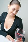 Beautiful young lady with a glass of wine
