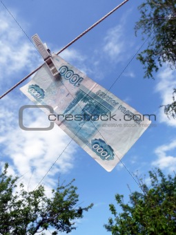 Russian money hanging on the clothesline. Money laundering 