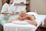 woman back massage treatment