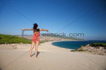 flying woman at Bolonia beach
