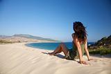 woman sits over Bolonia beach