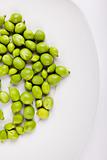 Fresh green peas on plate