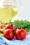 Cherry tomatoes and a bottle of olive oil