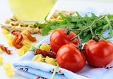 Cherry tomatoes and a bottle of olive oil