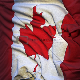 Flag of Canada, fluttering in the breeze, backlit rising sun