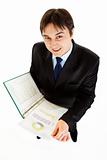 Smiling modern businessman with folder in hand exploring financial document
